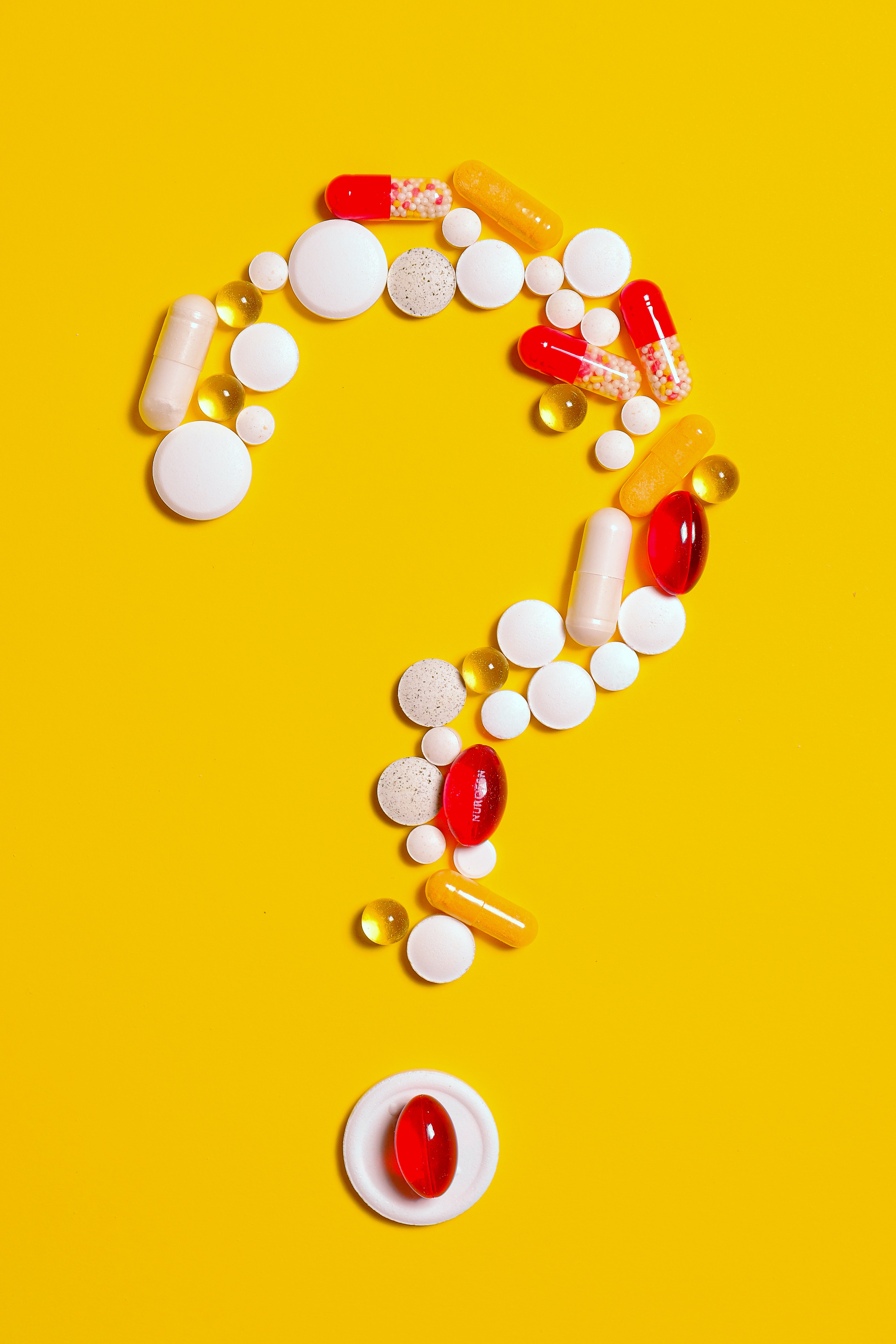 Pills in the form of a question mark