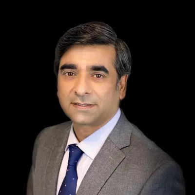 Headhsot of Anjum Khurshid