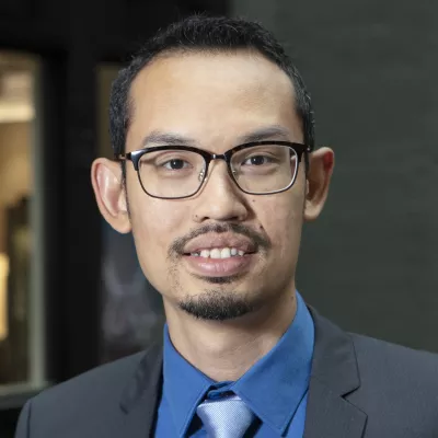 Headhsot of Izzuddin Aris