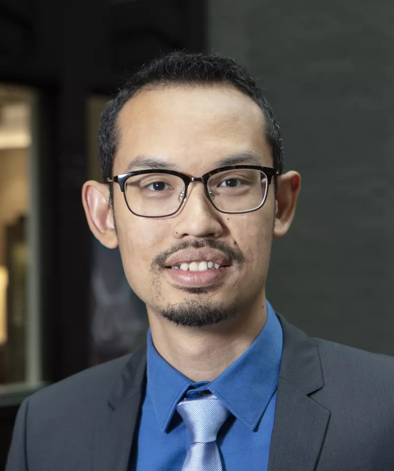 Headhsot of Izzuddin Aris