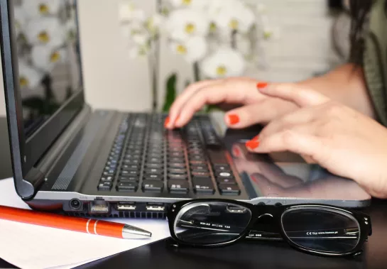 Woman typing on laptop