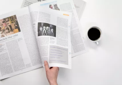 reading newspaper with coffee