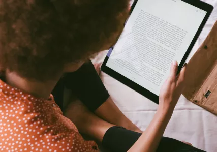 Woman reading on a tablet