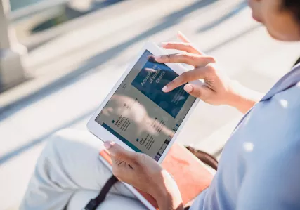 Woman reading on a tablet